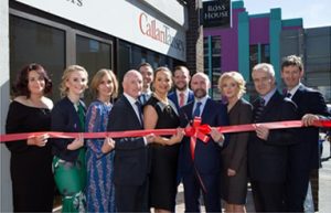 Callan Tansey staff opening Galway office with red ribbon