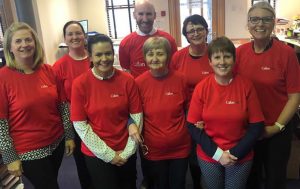 Callan Tansey staff in red t.shirts after raising funds for Temple St hospital