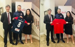 Brian Gill and Caroline McLaughlin holding Tshirt sponsored by Connollys & Sligo Rovers
