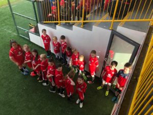 Children in Sligo Rovers kit about to walk on pitch