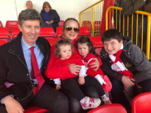 Callan Tansey staff members with children at Sligo Rovers game