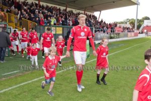 Sligo Rovers Team coming on pitch with children mascots