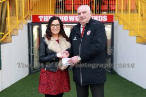Caroliine McLaughlin giving cheque to Sligo Rovers staff