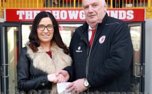 Caroline McLaughlin presenting match sponsorshipcheque to representative of Sligo Rovers