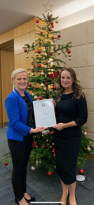 Niamh Receiving Q6000 Accreditation from Julie Brennan, Institute of Research and Legal Standards